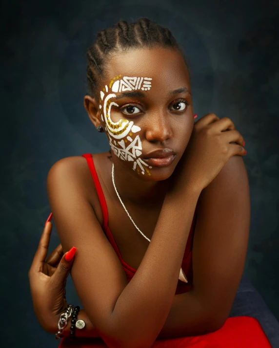 a woman with white makeup and decorations on her face