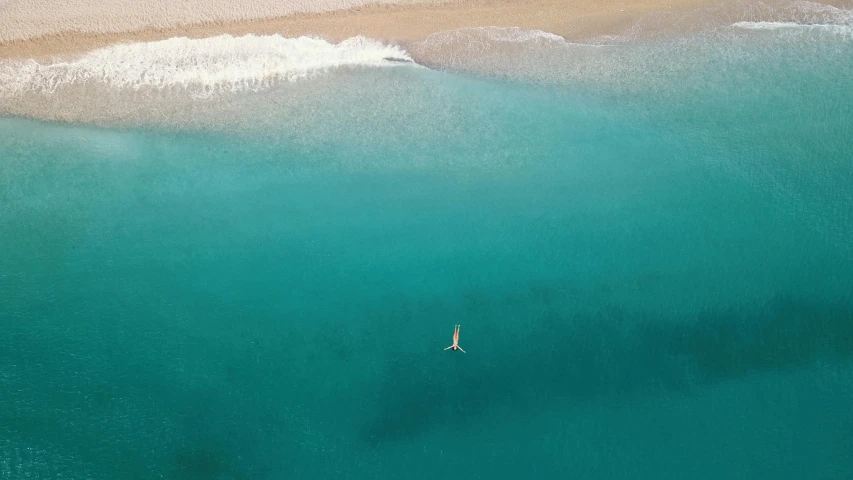 a lone person in the ocean