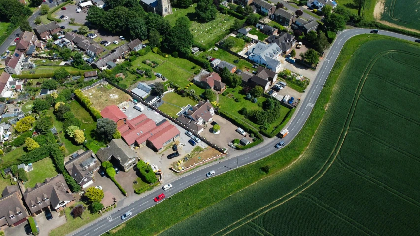 an aerial view of houses with roads winding into them