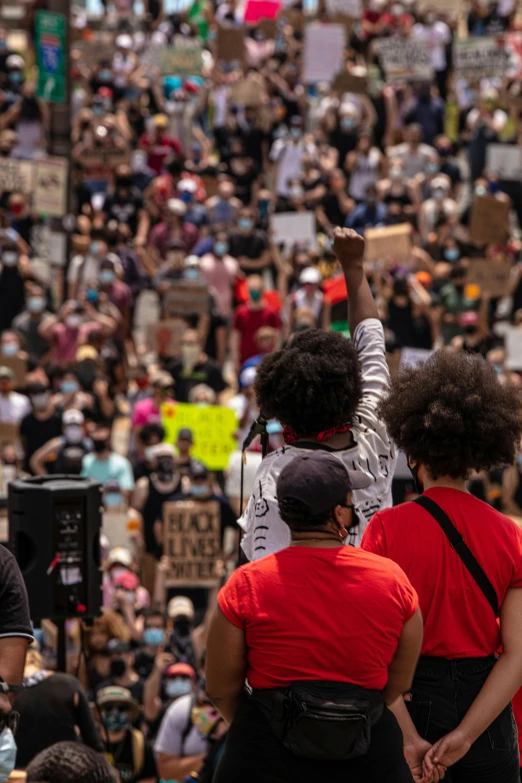 there is a large crowd of people that are protesting