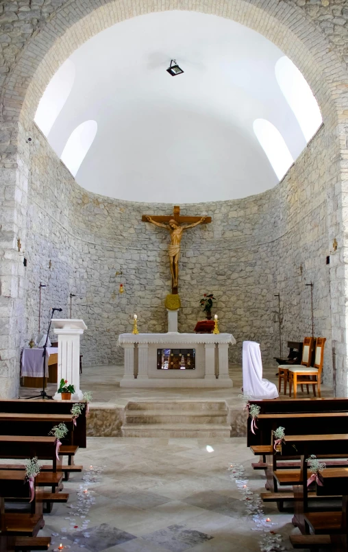a view of inside of an indoor catholic church