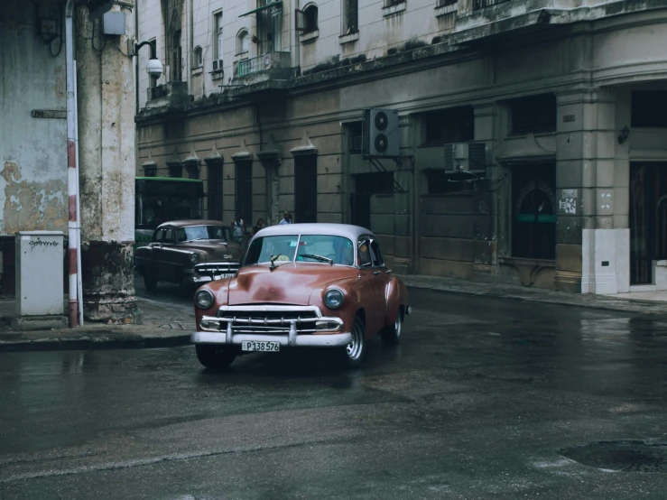 the car is parked in the middle of the street