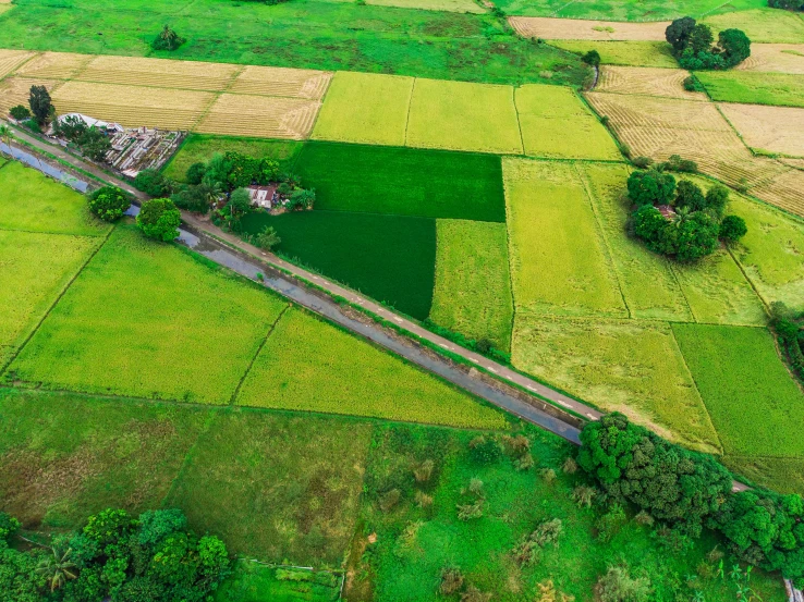 a large open field next to a highway