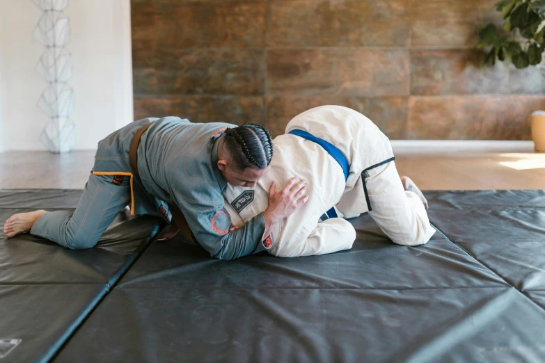 an athlete performing an exercise on a mat