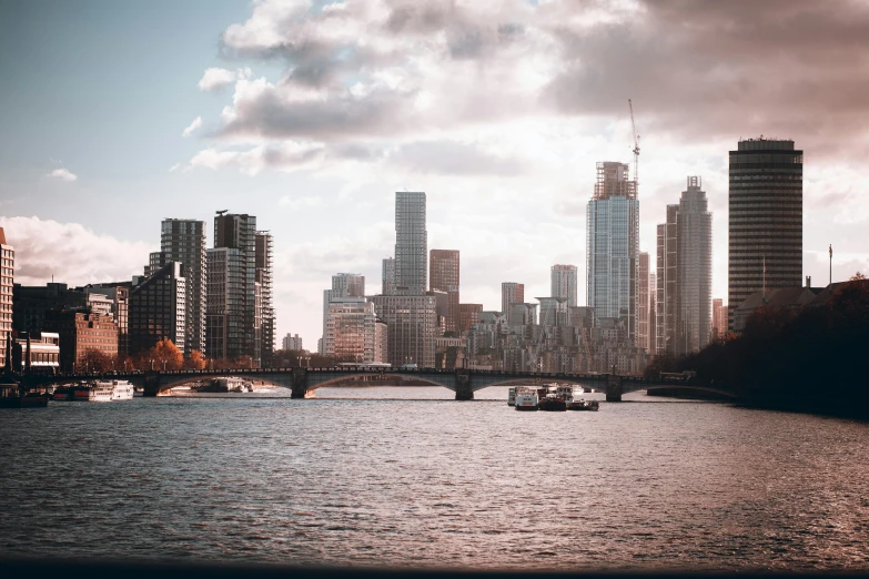 boats are in the water along with a city skyline