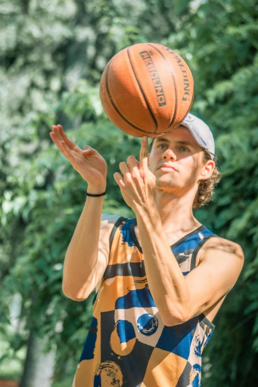 a man about to slam the basketball with his hands