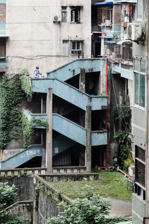 the view of a building with stairs in the yard