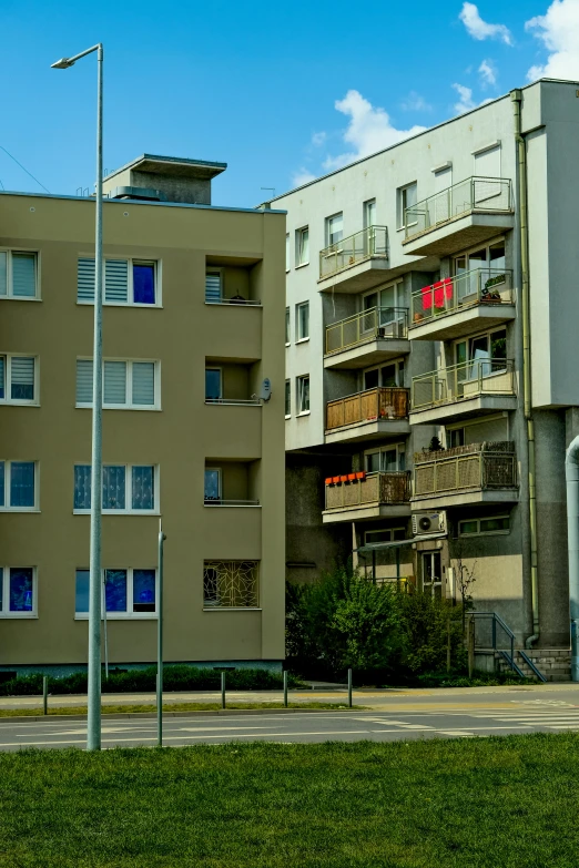 a large, multi - story building with balconies and apartments