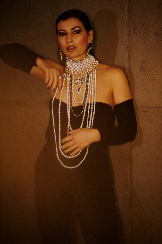 an image of a woman with pearls on her necklaces