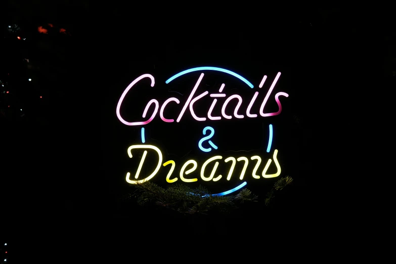 a neon sign with the words cocktails and dreams on it