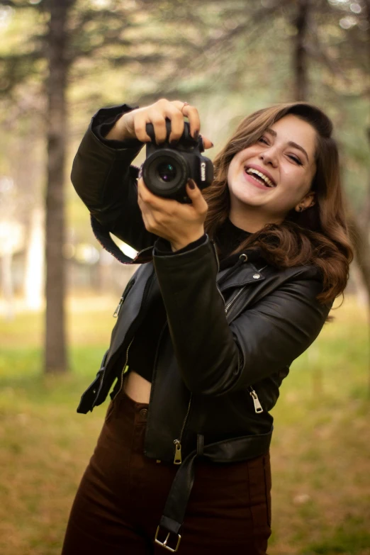 a woman taking a selfie with a camera