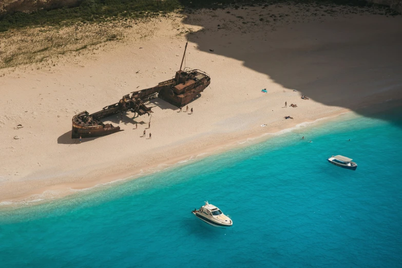 two boats that are floating on the water