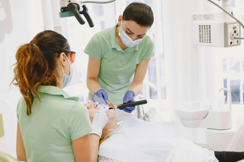 two people in a medical office doing soing