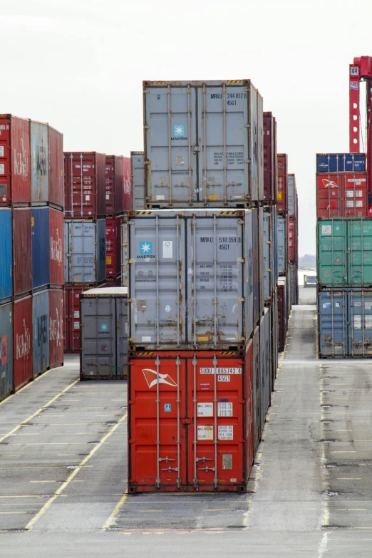 cargo containers with their lids opened in a parking lot