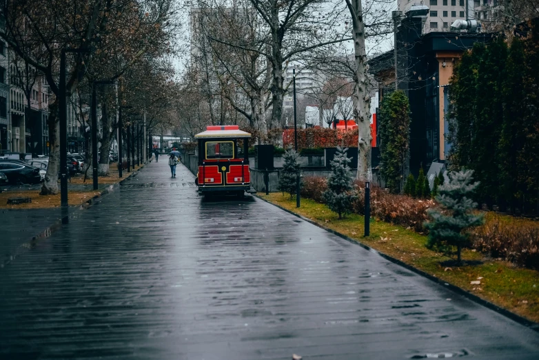 a bus on a road near many buildings