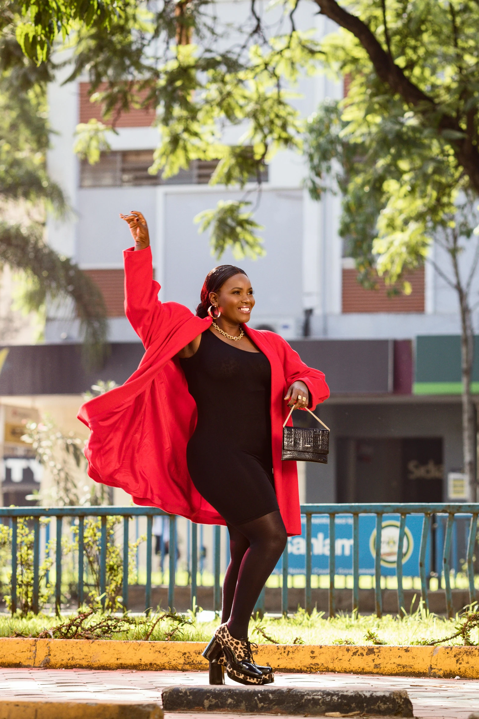 a woman in a black dress is dancing