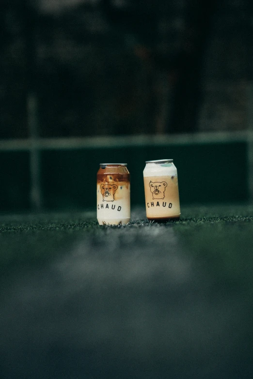 two cups that are sitting on the ground