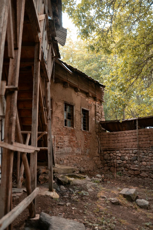 a very old wooden building with some broken windows