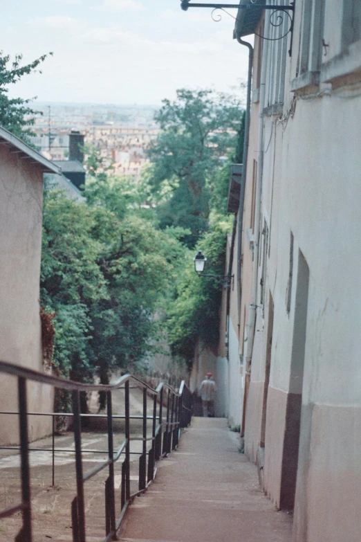 some people standing on some stairs in front of buildings