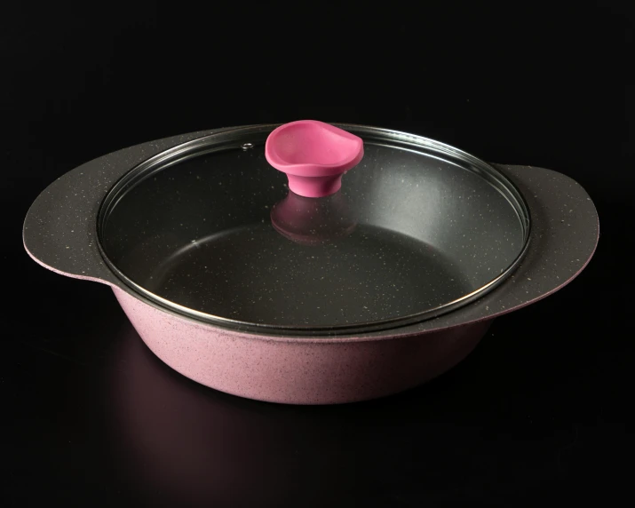 a pan is covered in a pink cup