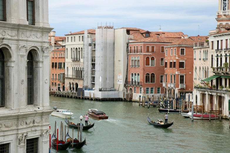 a wide river in an urban setting next to buildings