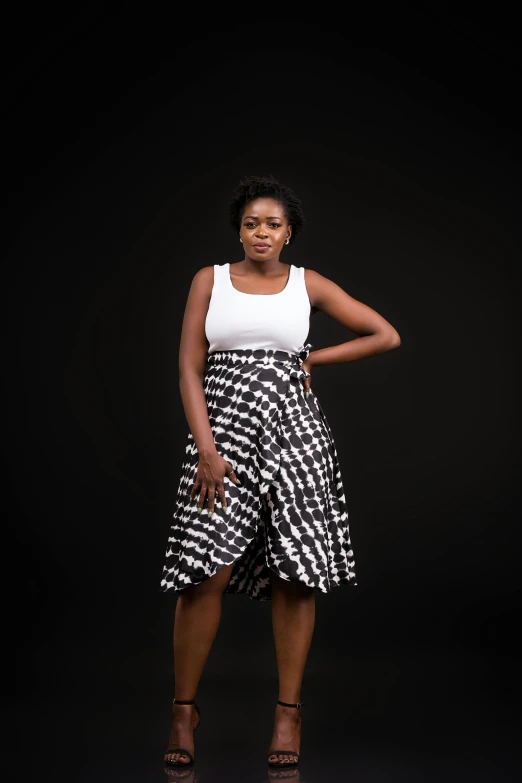 woman in black and white dress with dark background