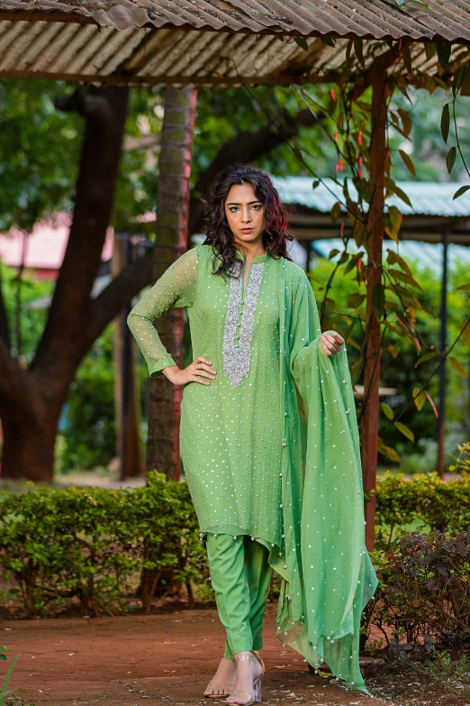 an indian woman wearing green clothes