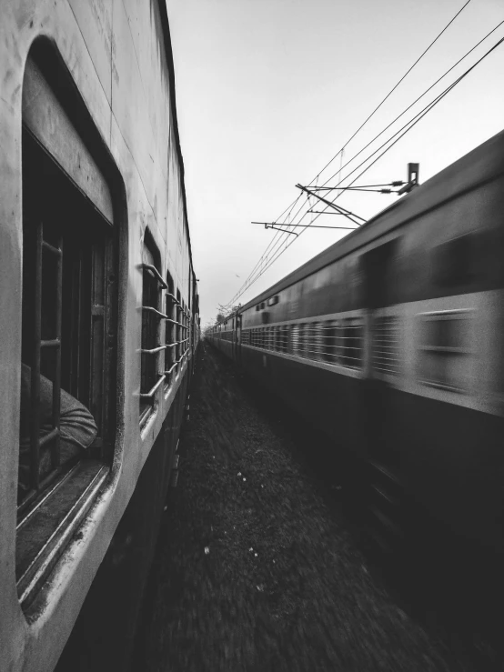 train passing down a track near an old building