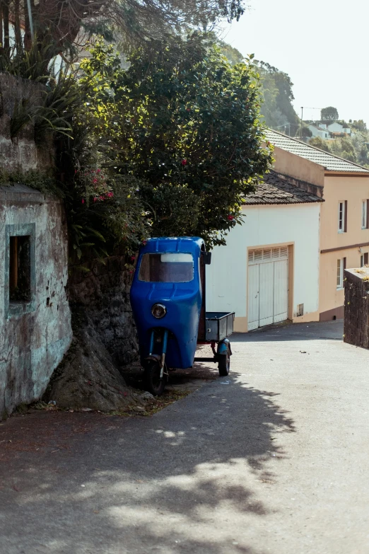 a blue truck parked on the side of a street