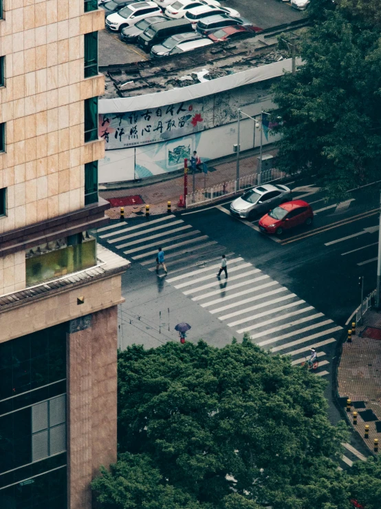 looking down at an intersection with several vehicles