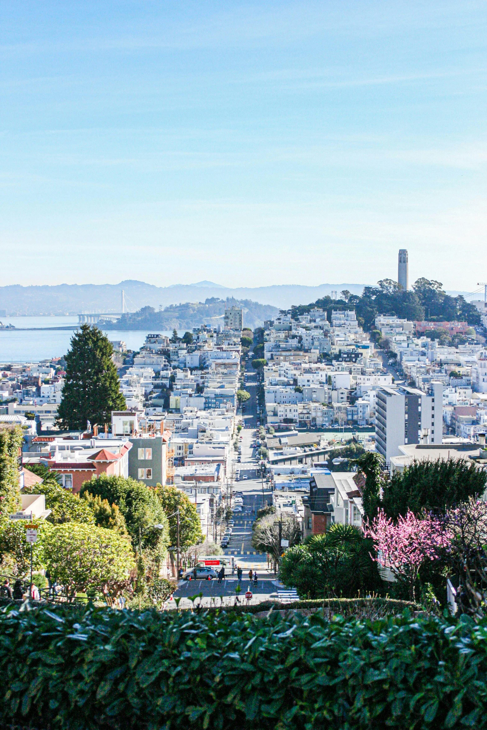 an aerial view of a city with its mountains in the distance