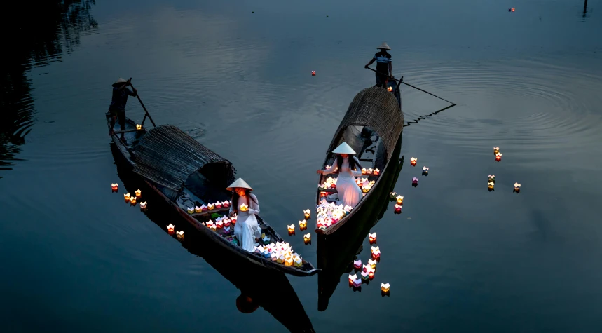 two boats that are sitting in the water