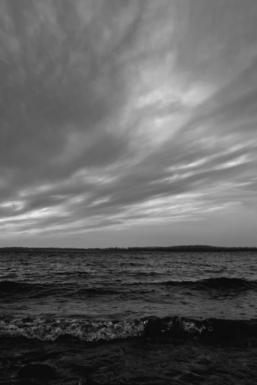 a view of some clouds with some water and land