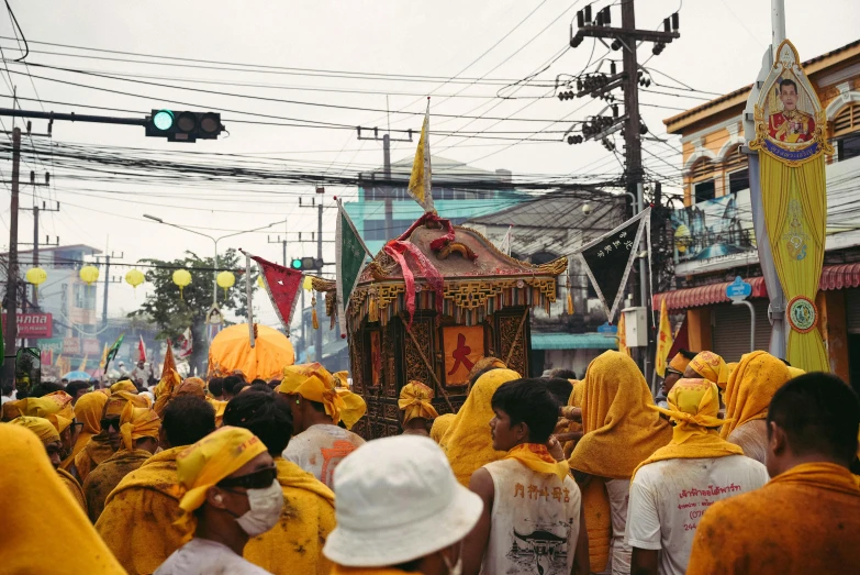 a parade of people in yellow costumes