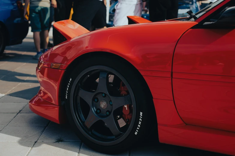 a close up of the rims on a sports car