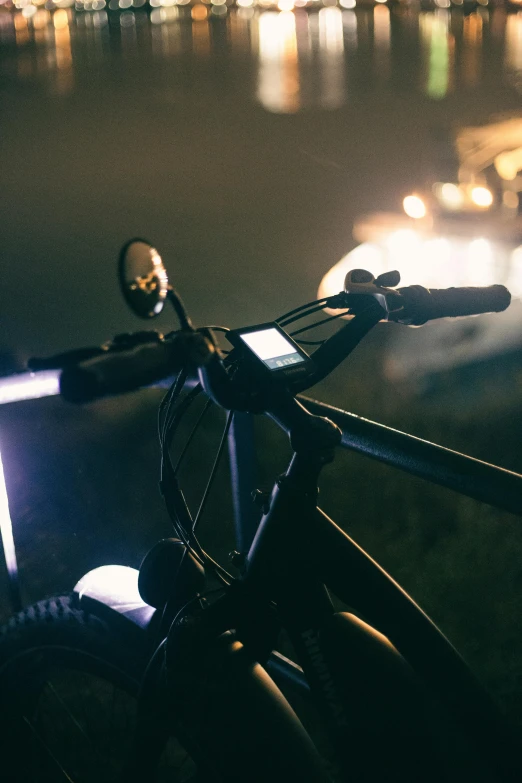 a bicycle is parked by a body of water