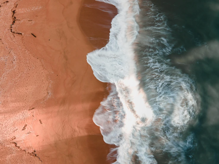 the ocean is brown and gray near the shoreline