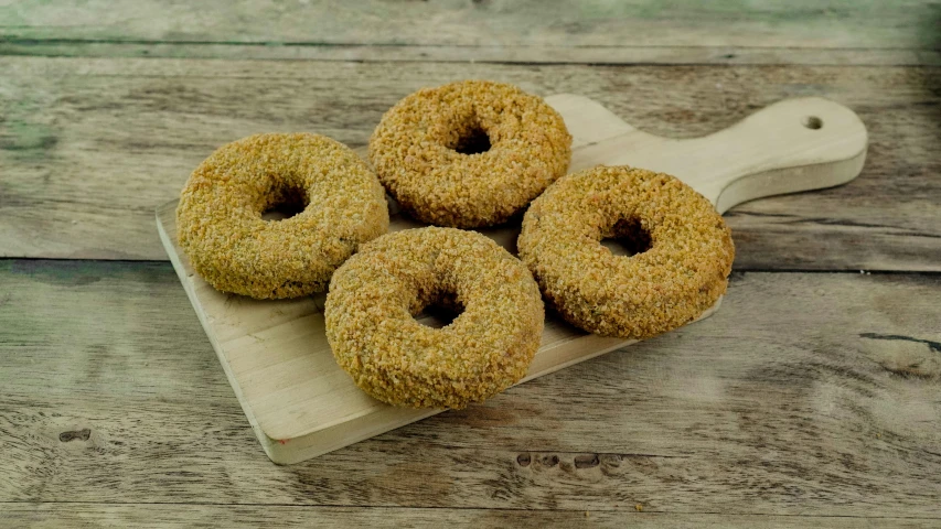 the donuts are placed on a  board