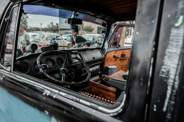 a car with the door open and dashboard in the background