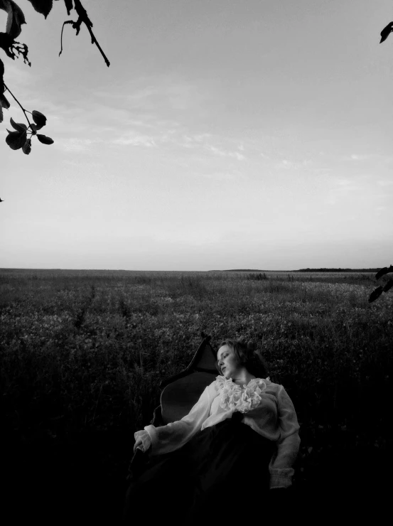 a person laying on their back in a field