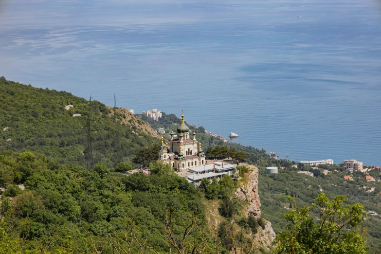 a building sitting on the side of a mountain