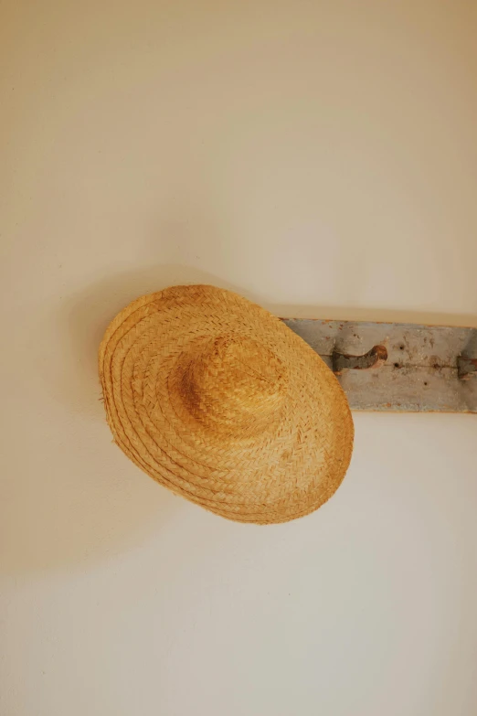 a hat on the wall of a bathroom