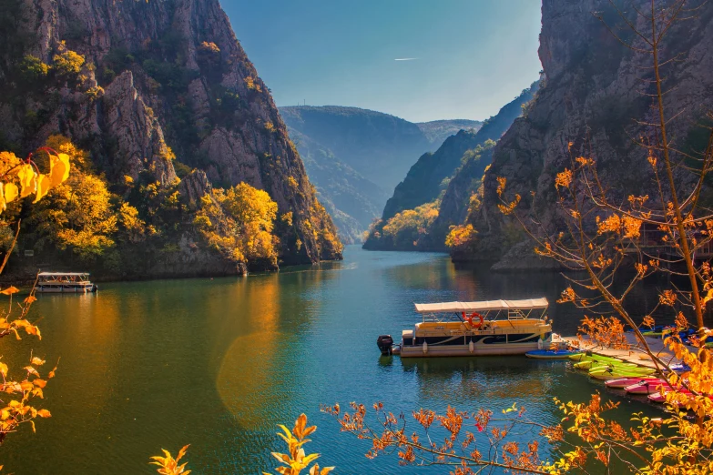 a group of boats parked on the side of a body of water