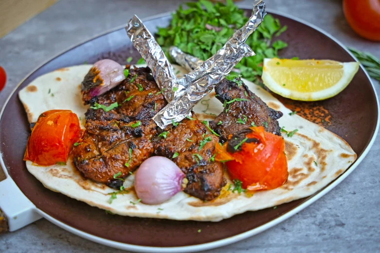 an item on a brown plate with other vegetables and spices