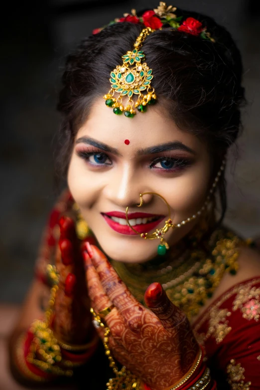 a close up po of a woman holding her hands up