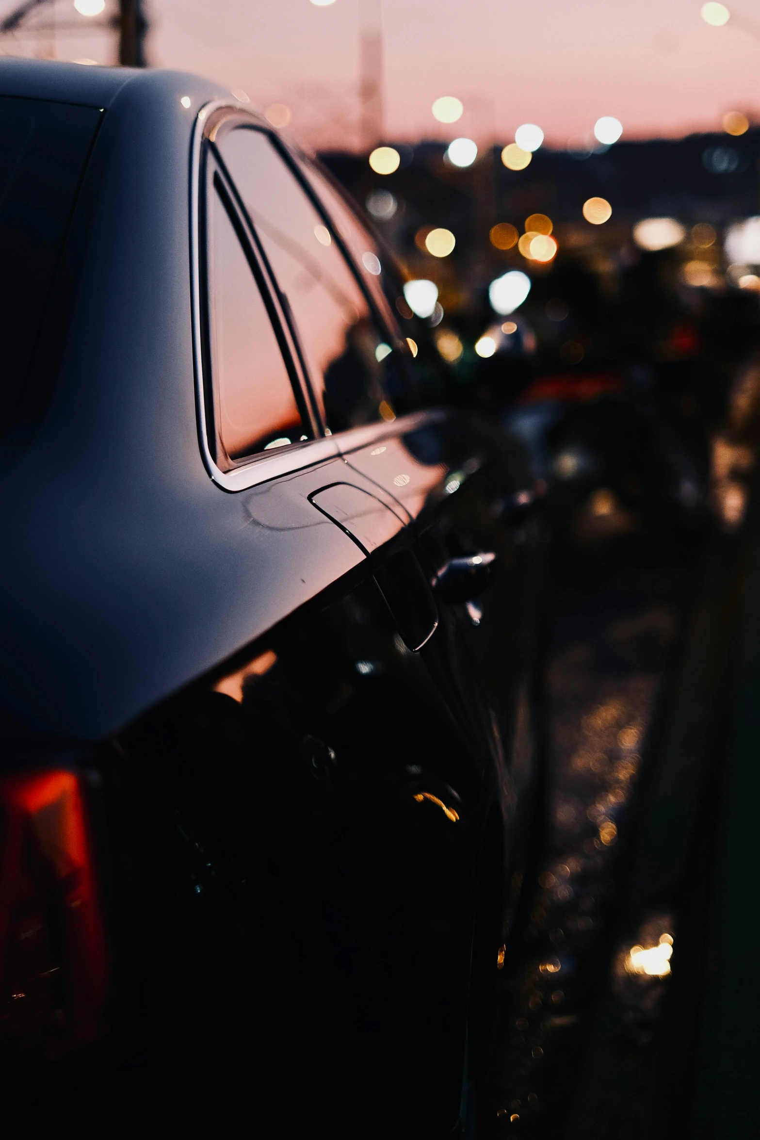 a car parked next to a building and a couple of bicycles