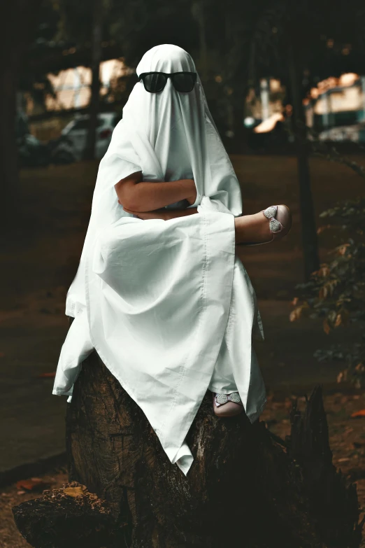 a person wearing white and standing on a log