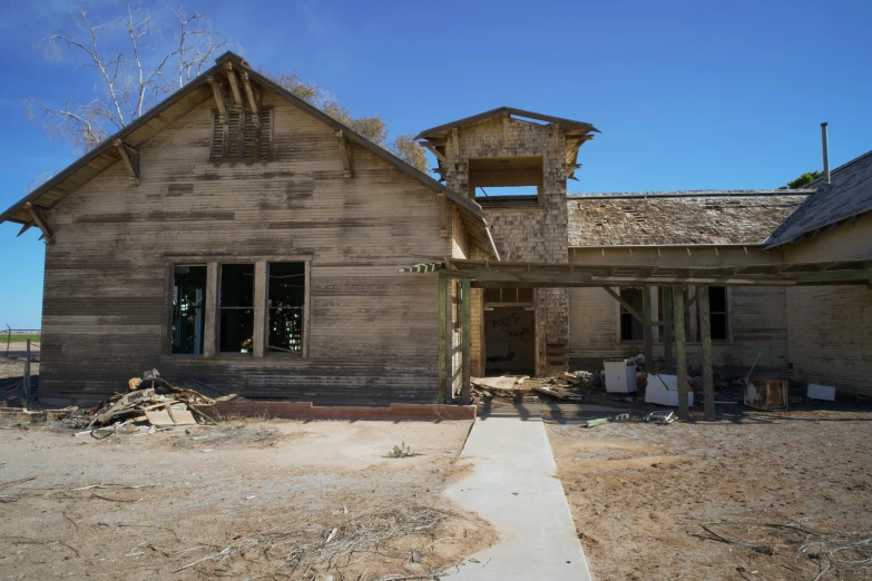 an old abandoned house with a lot of windows