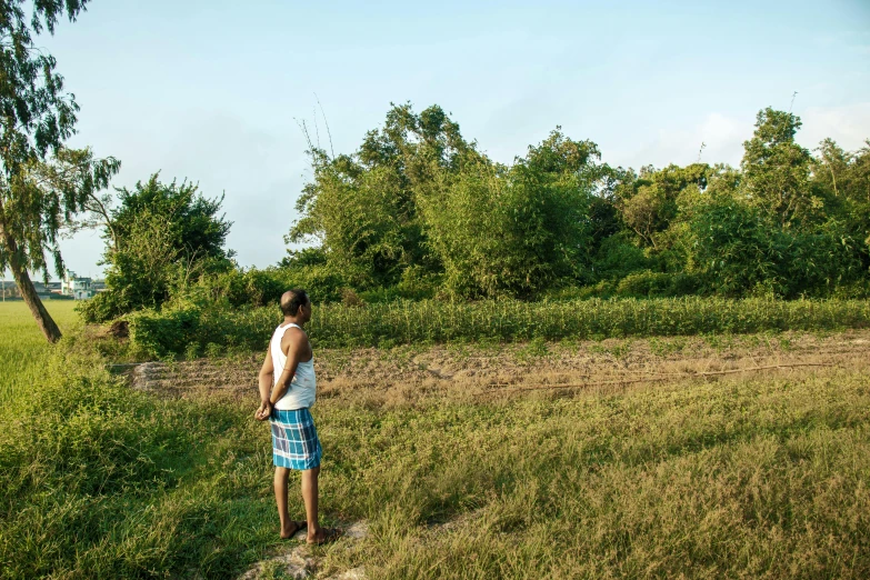 man standing alone looking at soing in the distance