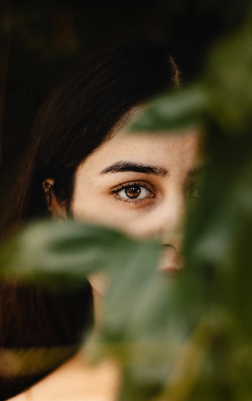 a close up view of a woman with brown eyes